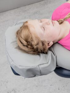 Symmetrical dental chair head support cushion for children